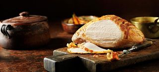 How to cook a turkey crown 5 - How To Make Roast turkey on a wooden board with two slices carved
