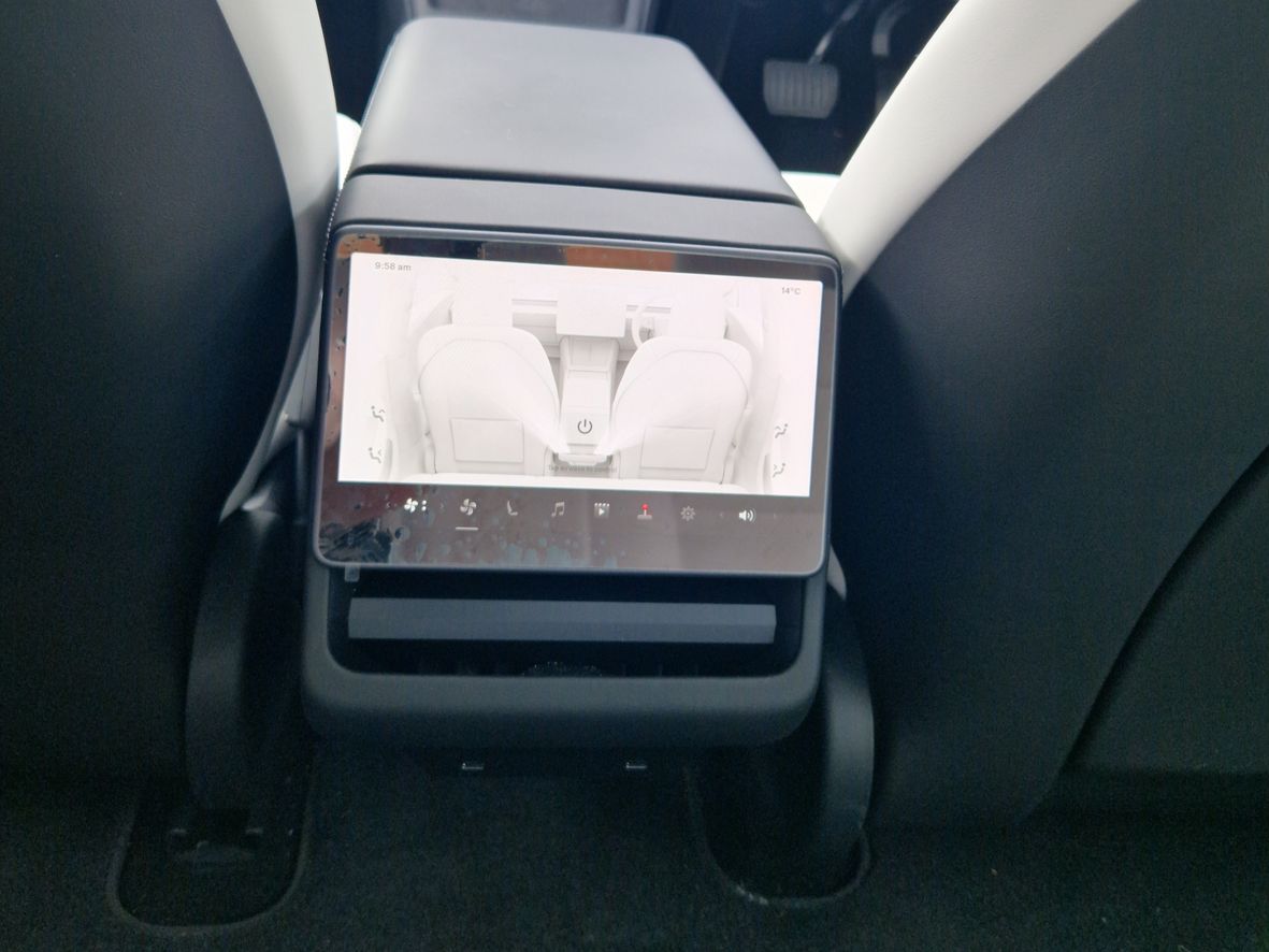 Centre console viewed from the rear in a Tesla Model 3 2024