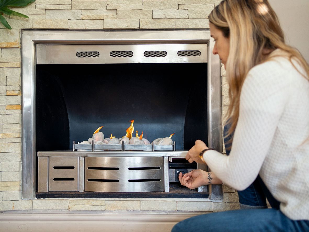 A modern gas fire with stainless steel finish