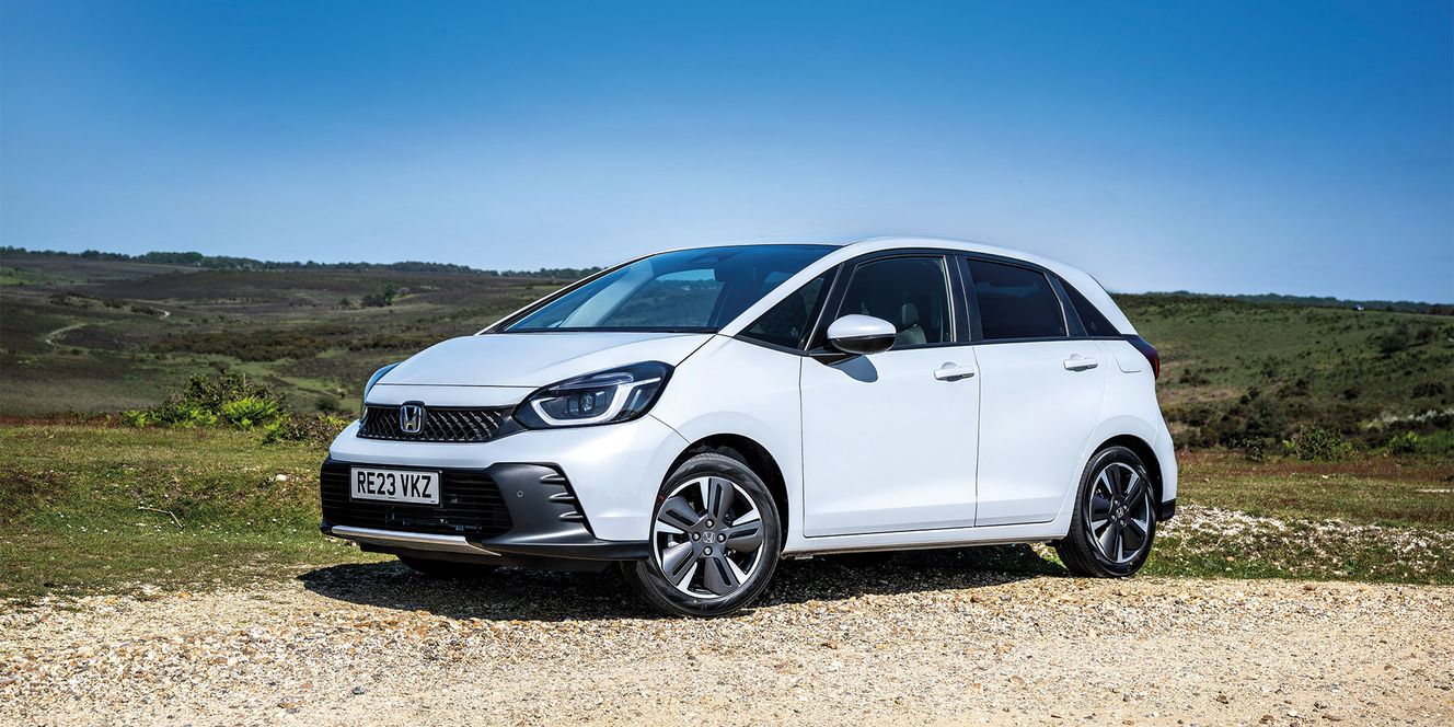 White Honda Jazz in the countryside
