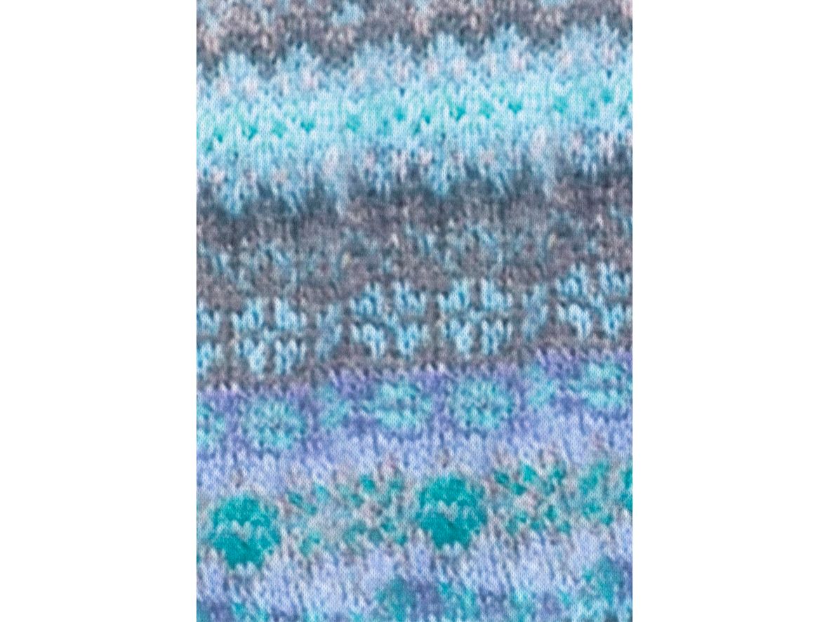 Close-up of the printed knitted design on the cardigan.