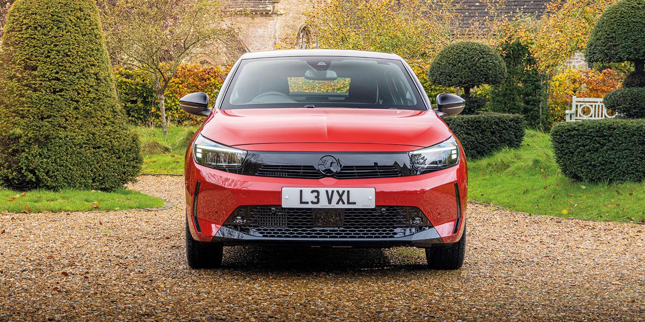 Red Vauxhall Corsa on gravel