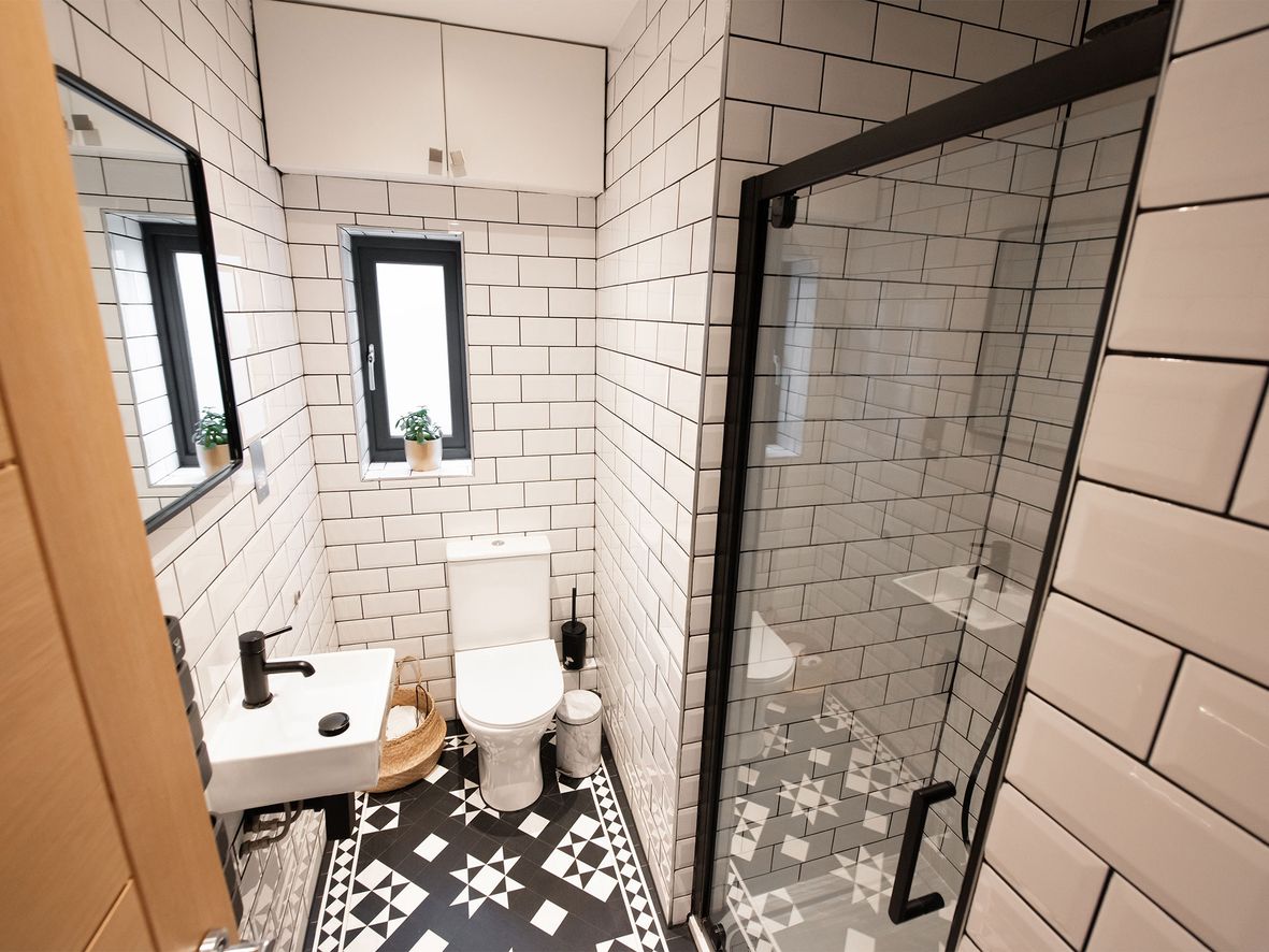 small bathroom with patterned tile floor