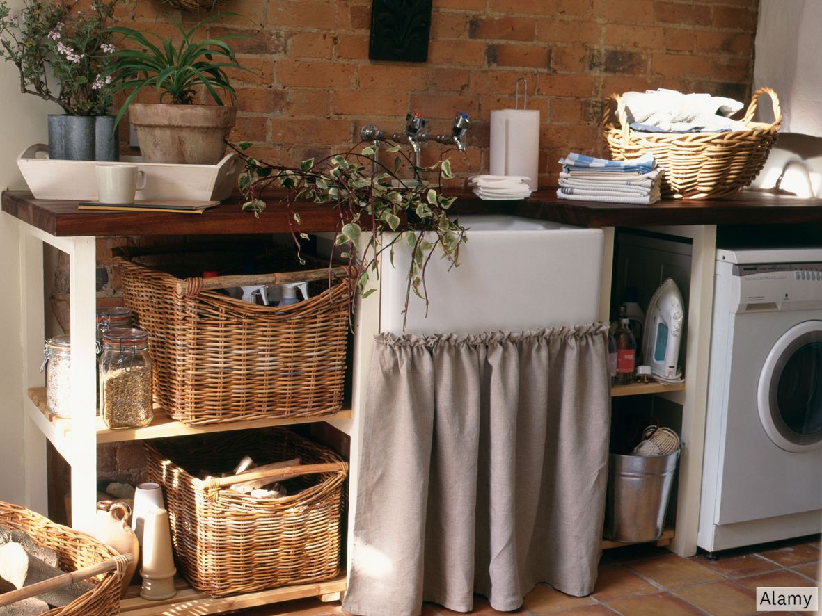 The exposed brick wall gives a rustic feel to this utility area. The café curtain is budget-friendly and brings character - you can also easily change this to give the room an instant update.