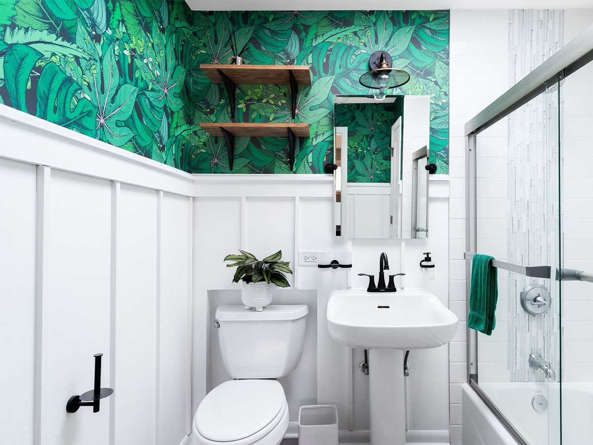 small bathroom with panelling and palm print wallpaper