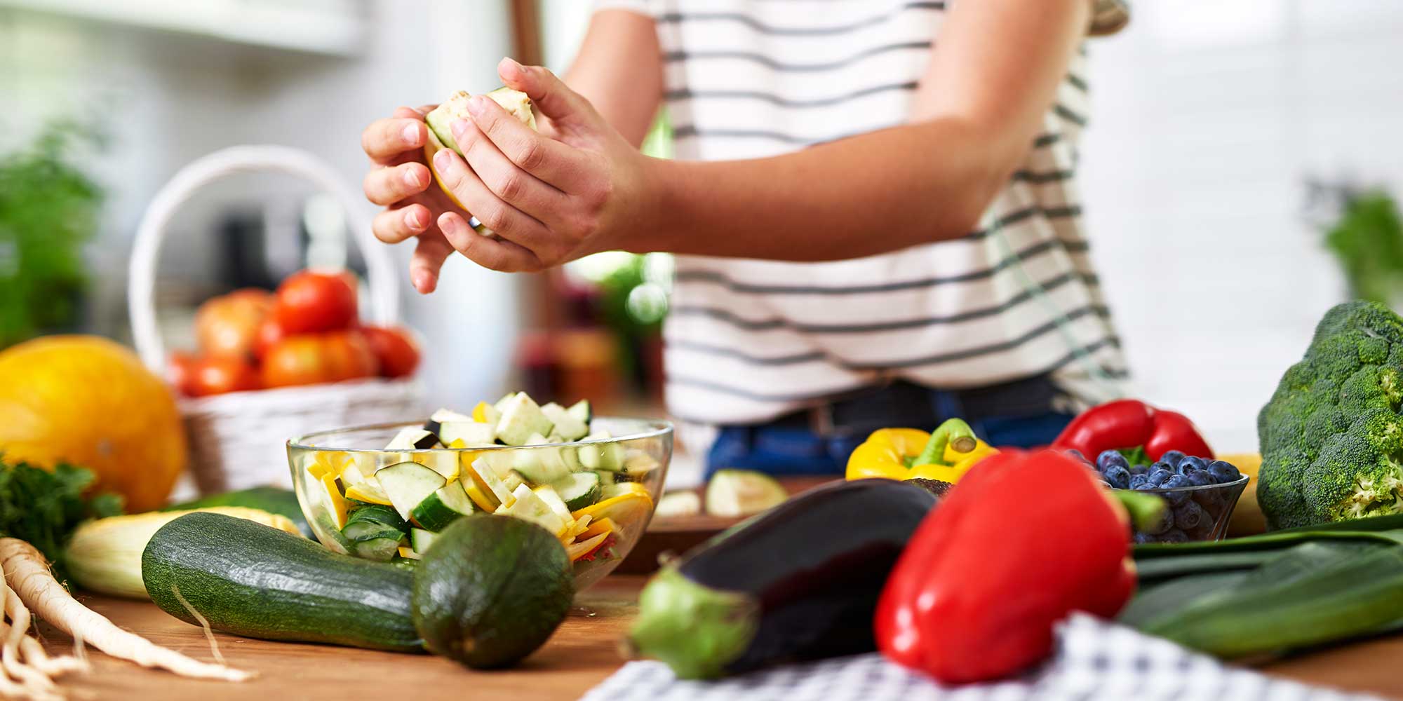 Woman preparing light and healthy summer salad