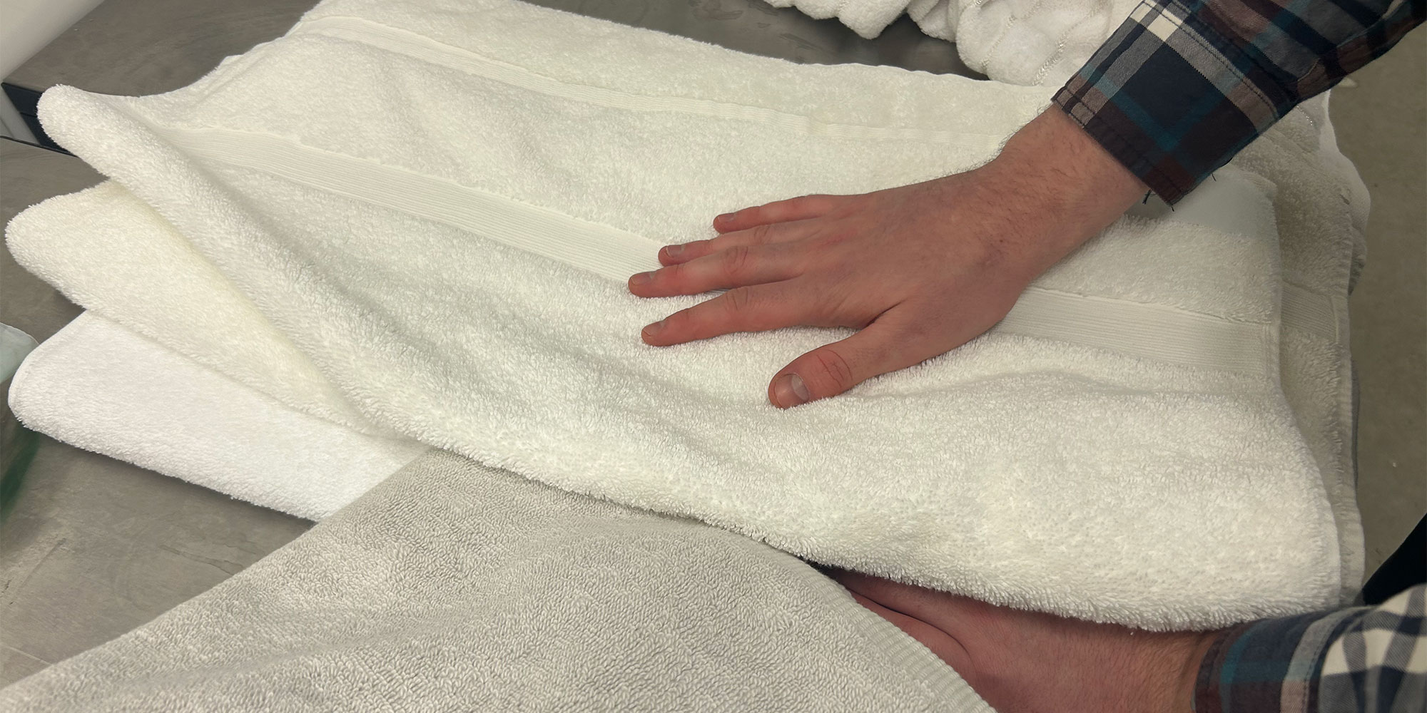 Panel tester feeling the towels for comfort