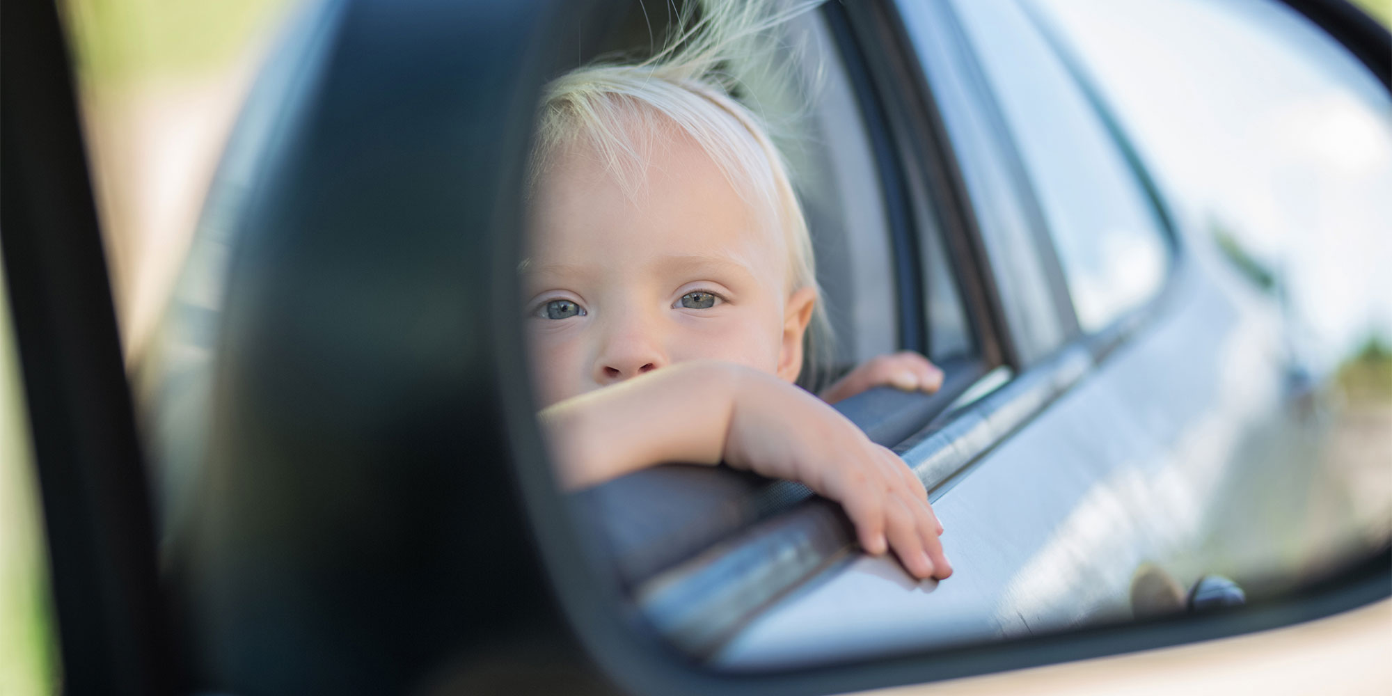 Child in a car looking out of the window