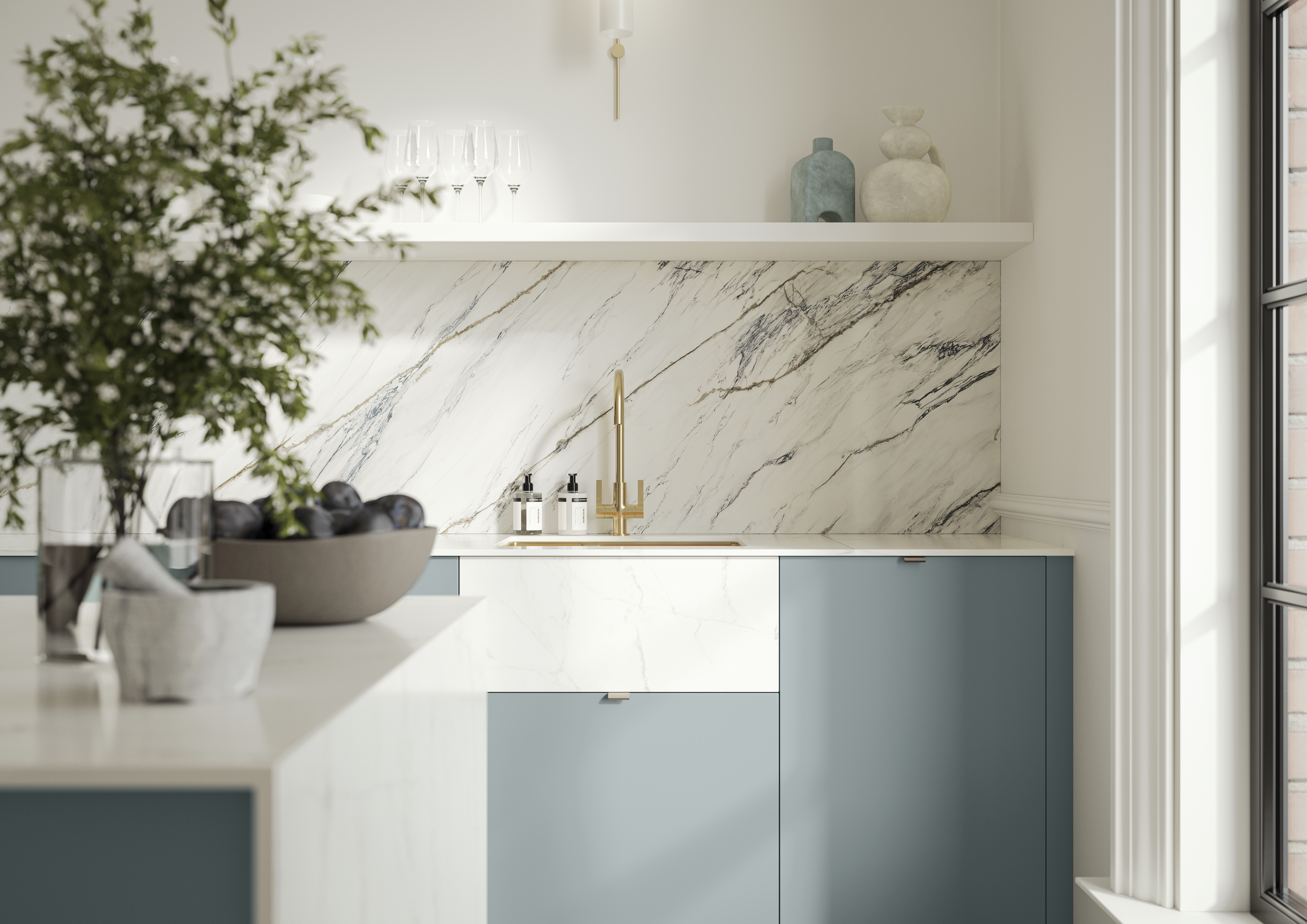 Blue kitchen with marble splashback