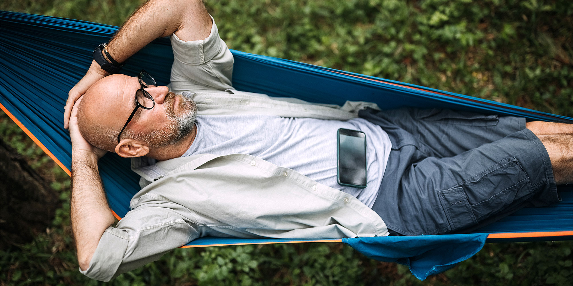 man relaxing in garden