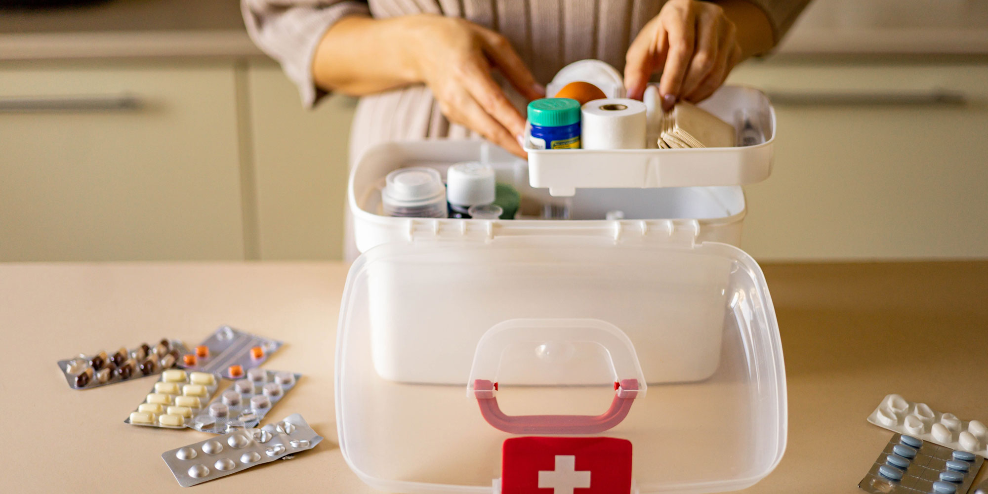 someone unpacking a first aid kit