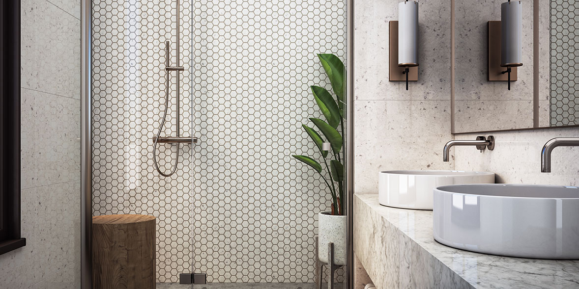 a small bathroom with hexagon wall tiles