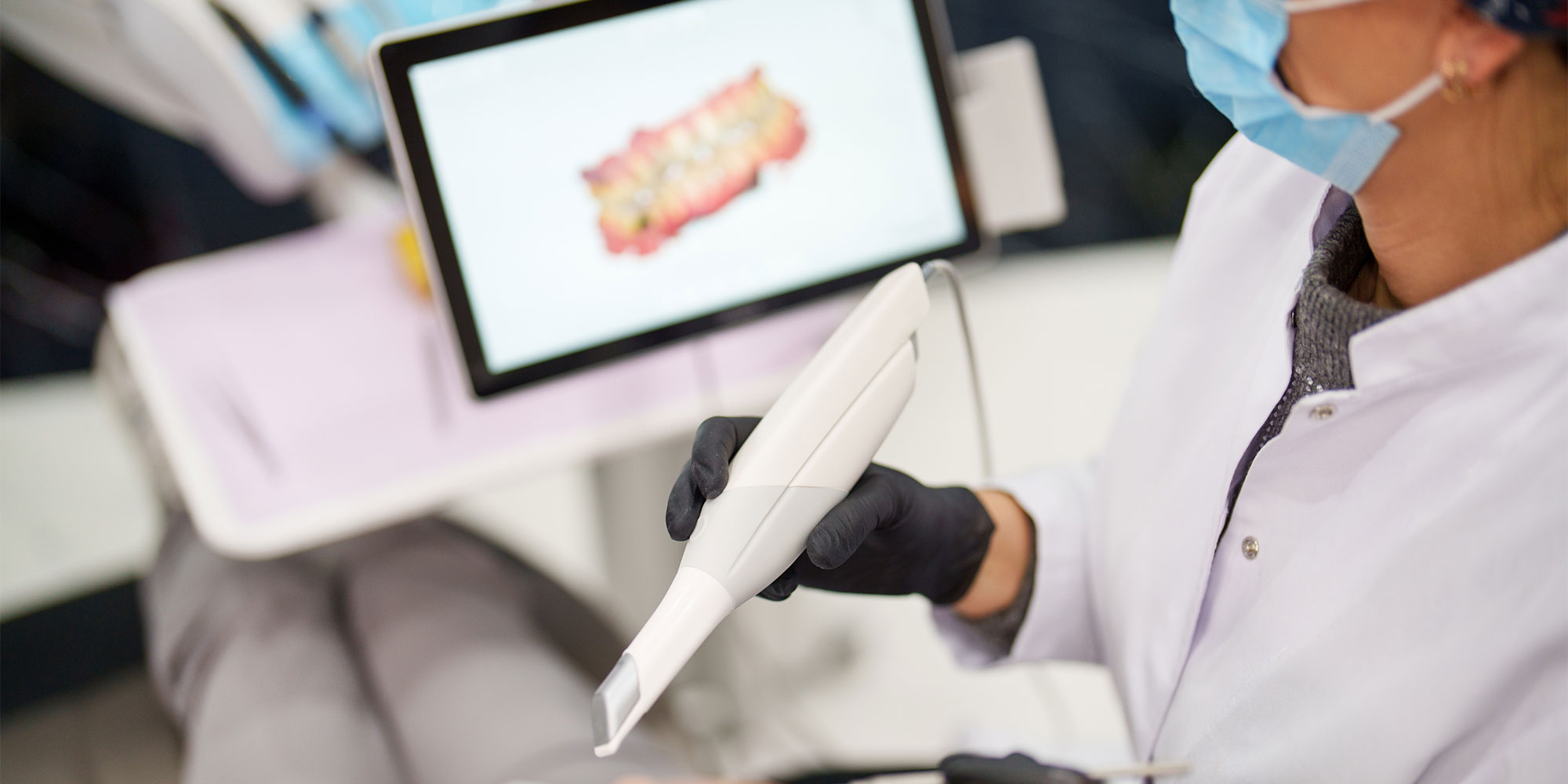 Dentist scanning an impression of someone's teeth