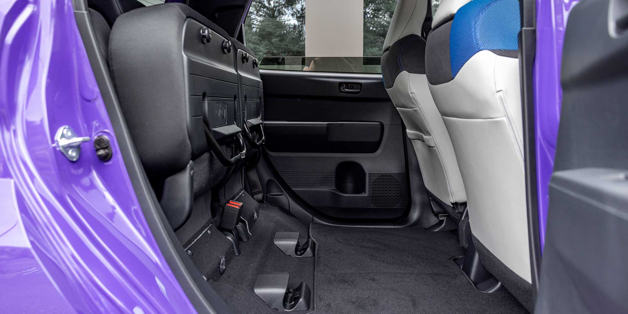 Interior of a purple Honda Super-N showing its 'magic' seats