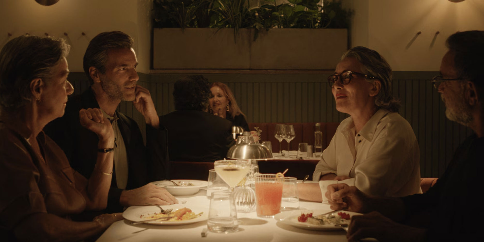 Woman wearing hearing aid glasses out for dinner in a restaurant 