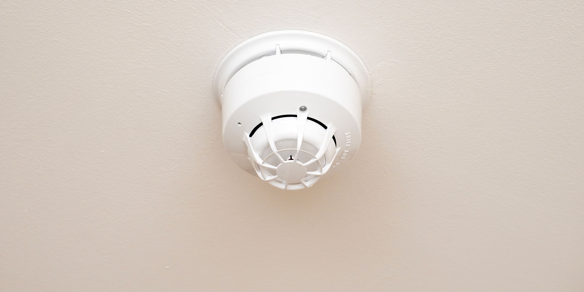A heat alarm on a ceiling