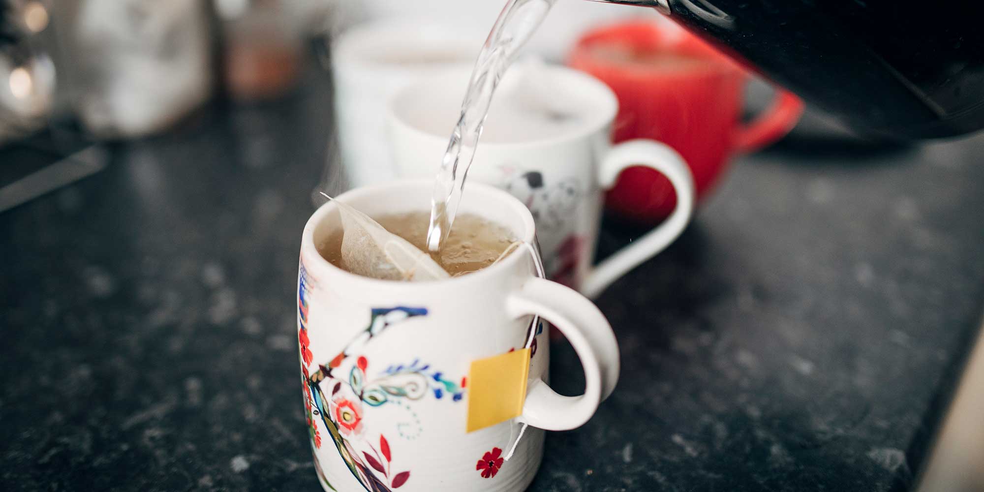 Boiling water being poured to make a cup of tea