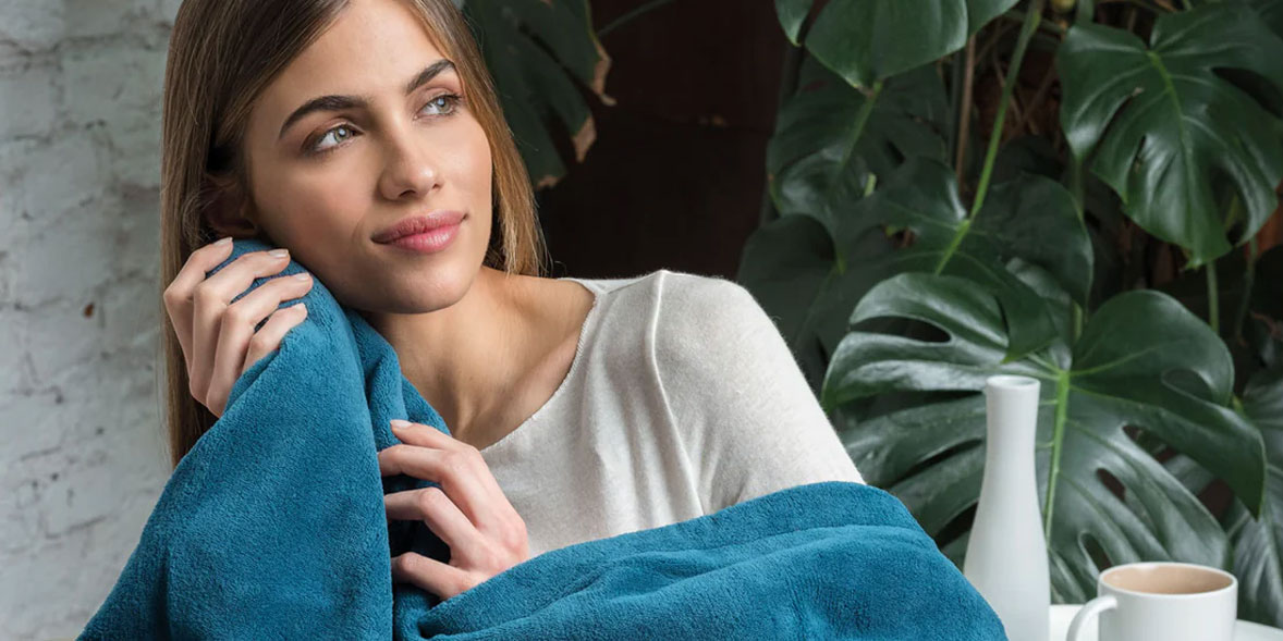 Woman with a heated throw