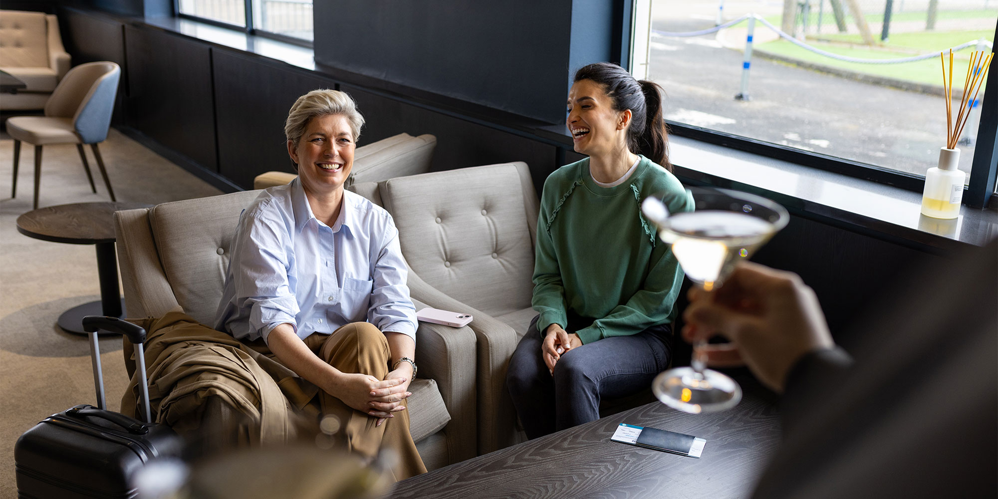 UK holidaymakers enjoying an airport lounge. Should you buy an airport lounge membership?