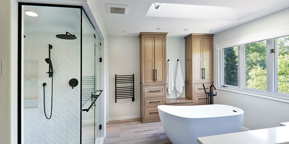 a white and wood themed bathrooom suite with a shower, bath and storage