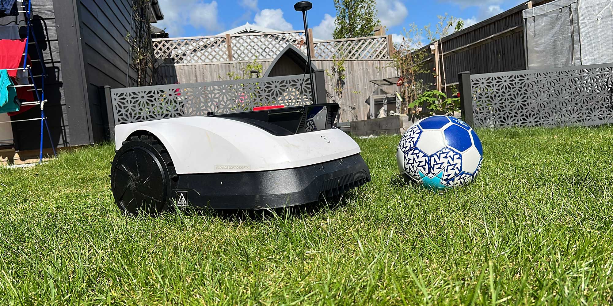 A robot lawnmower and a football