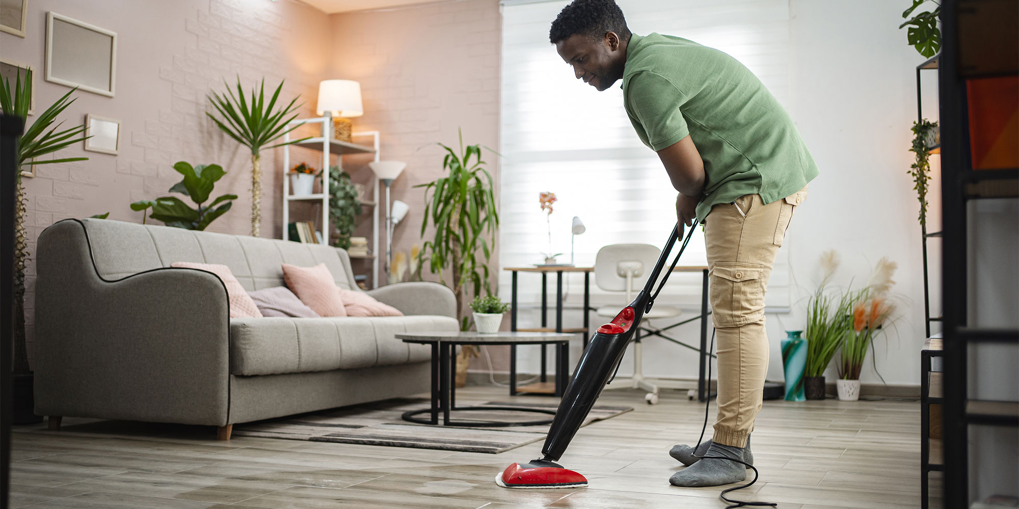 A steam mop being used on hardfloors