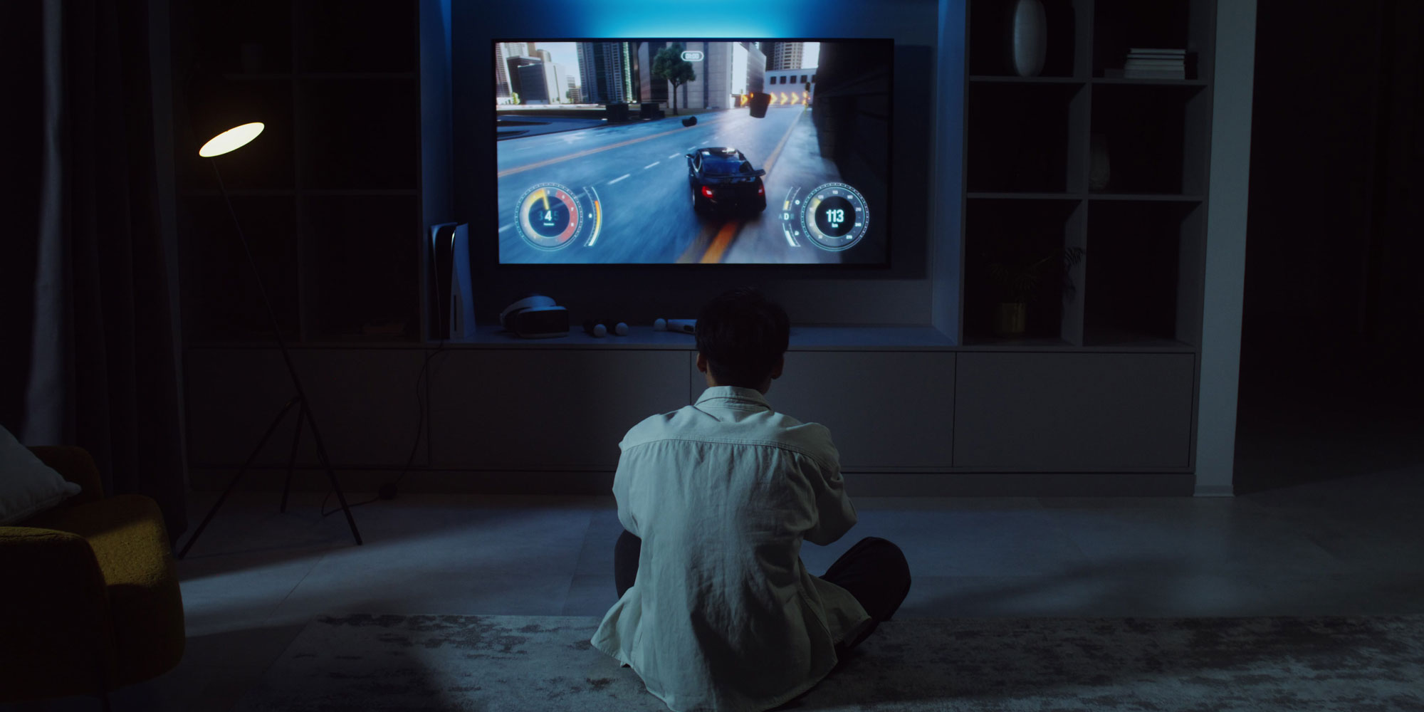 Someone playing a racing video game on their TV