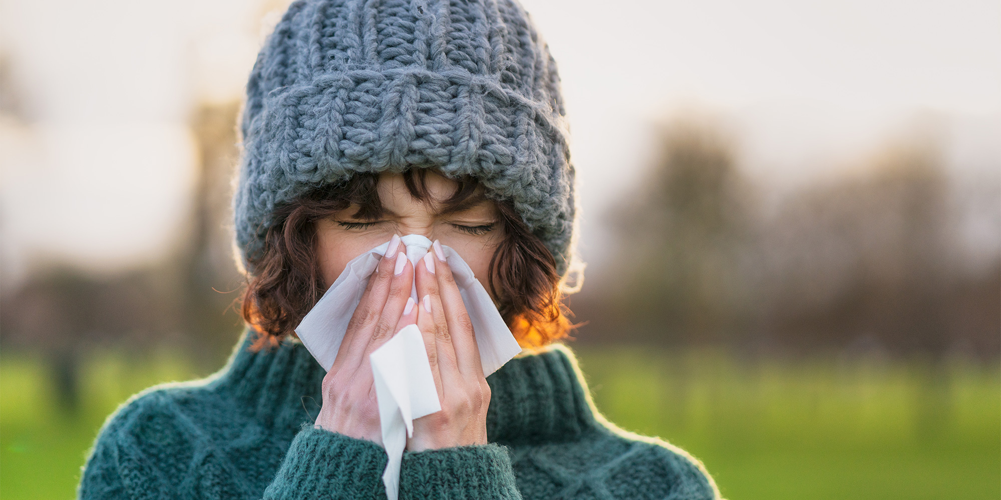 Woman sneezing