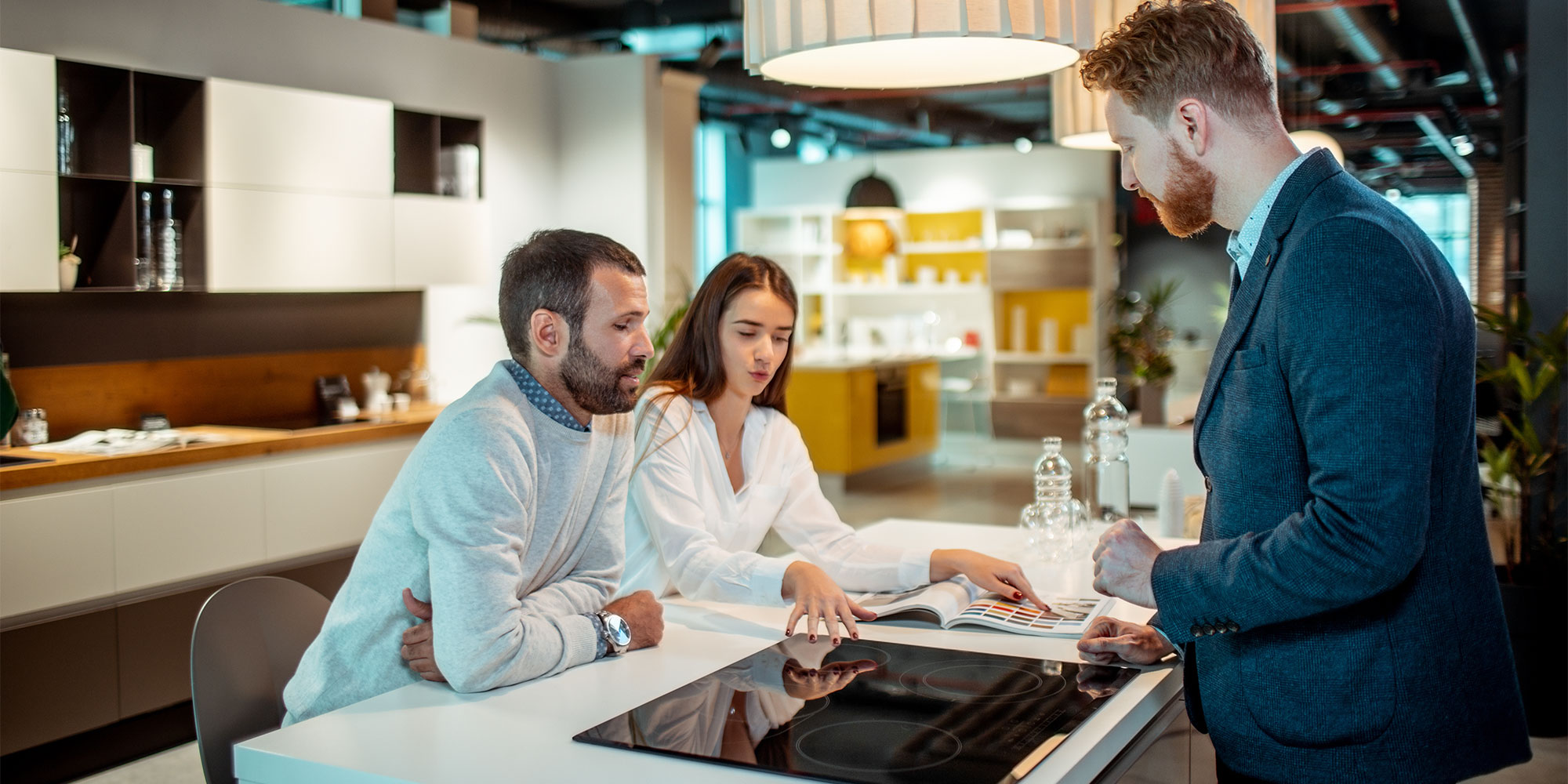 couple looking at samples in a kitchen showroom