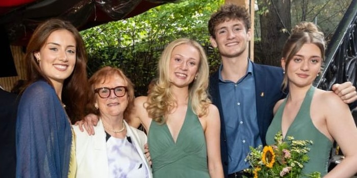 Anita Wilson wearing her Nuance Audio glasses at her son's wedding last year, pictured with her grandchildren
