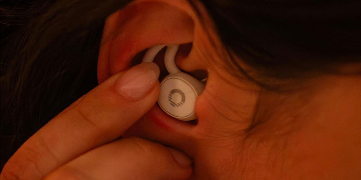someone wearing a pair of ozlo sleepbuds