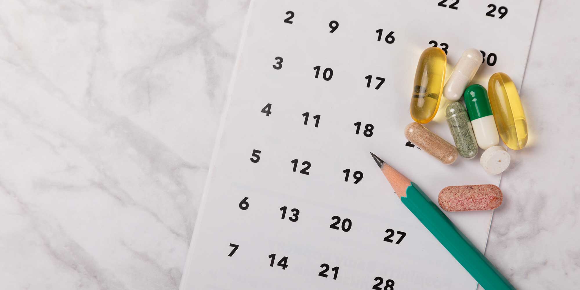 A calendar and some pills