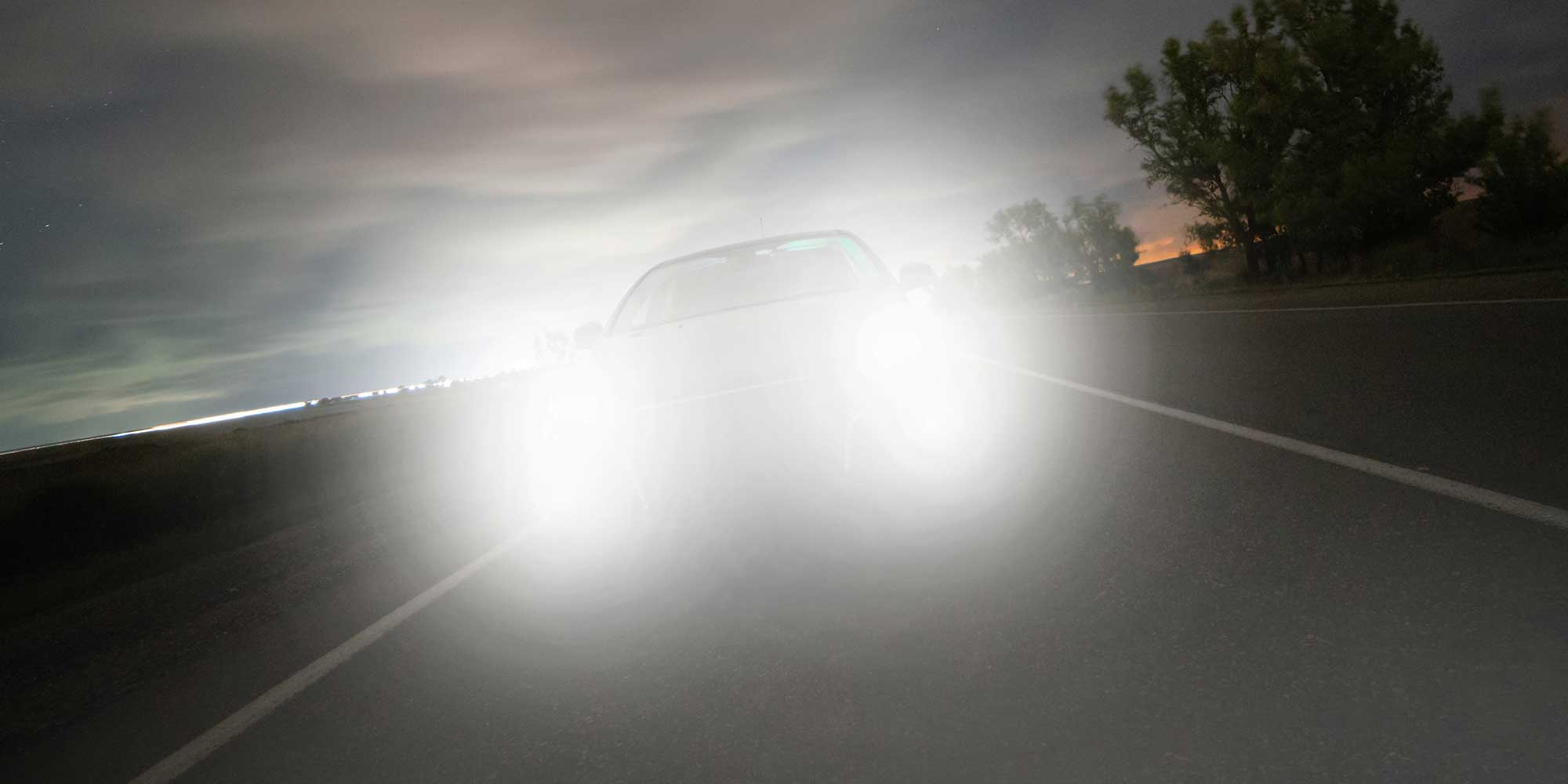 Car headlights dazzling at night