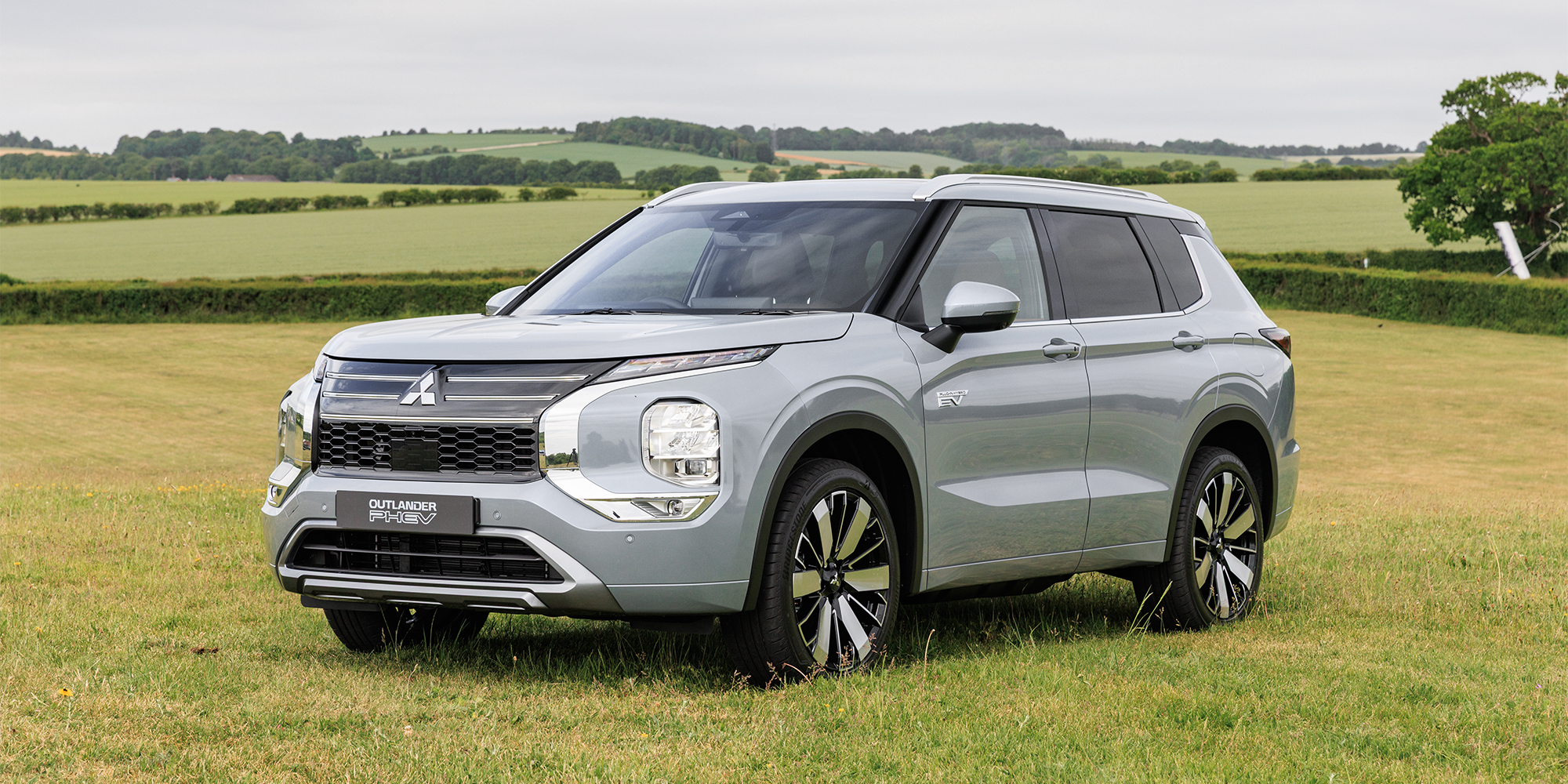 Silver Mitsubishi Outlander PHEV in a field