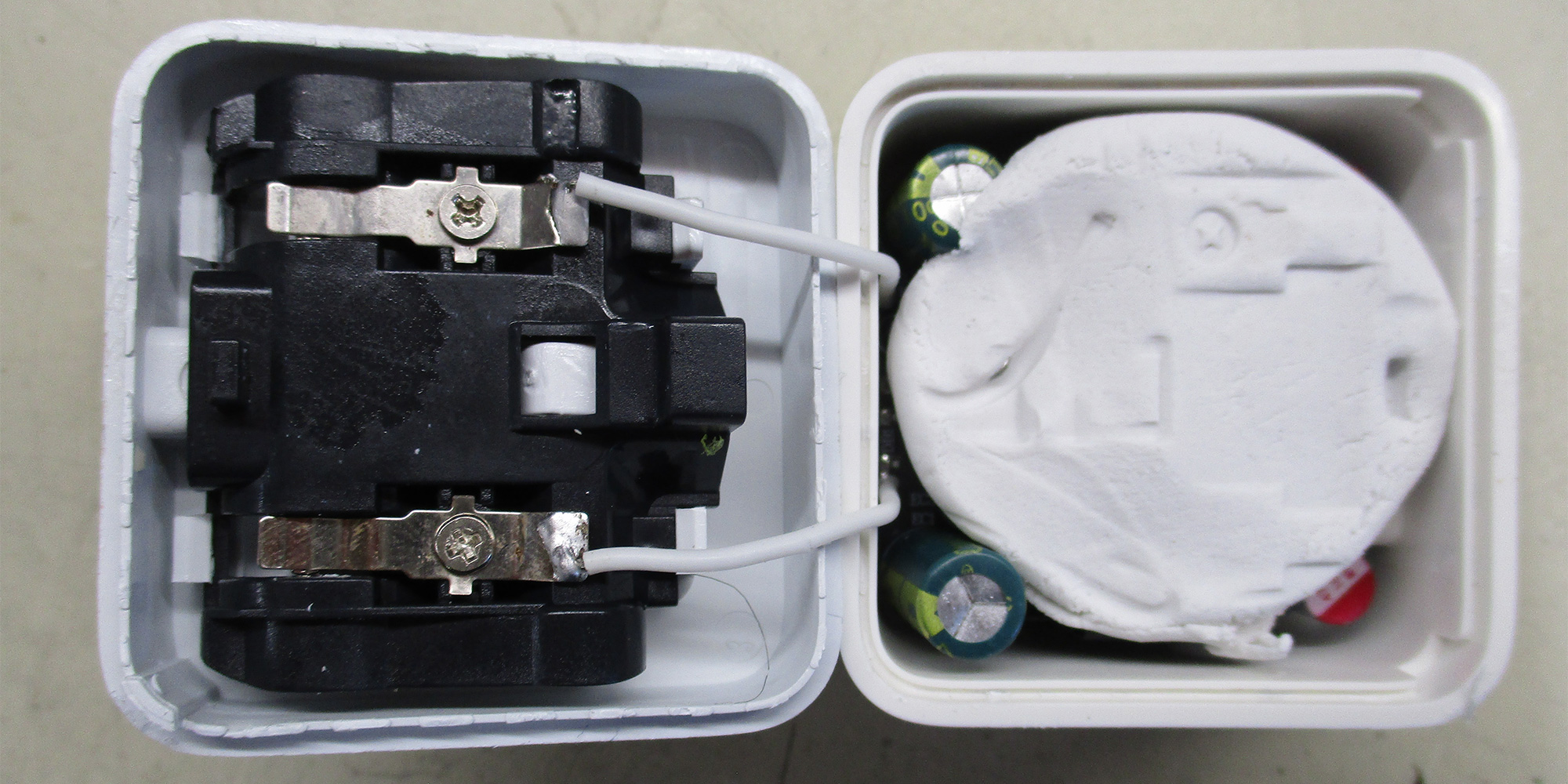 Putty fills the fake 'Apple' charger to make it feel more substantial.