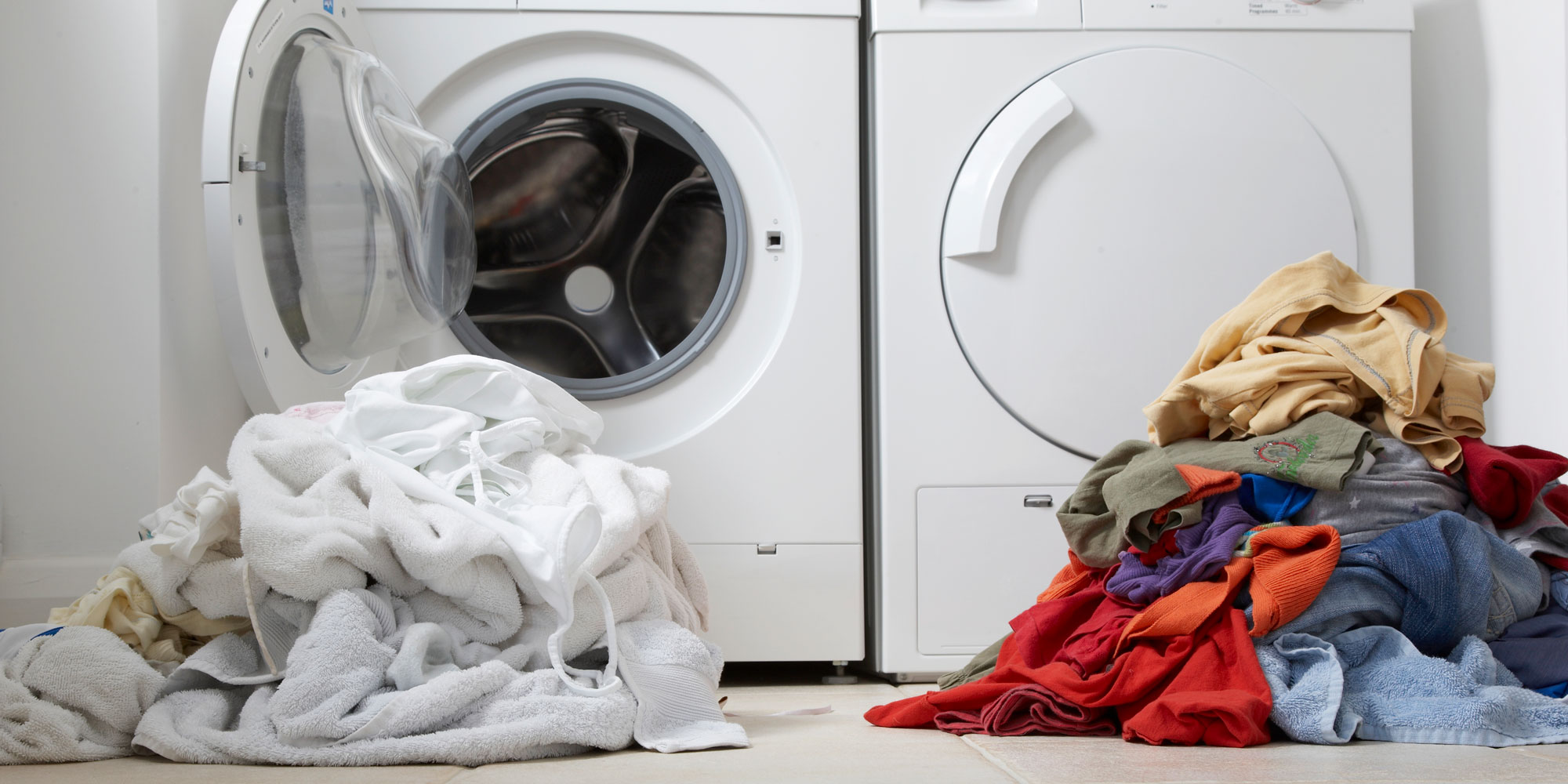 A pile of white and a pile of coloured laundry