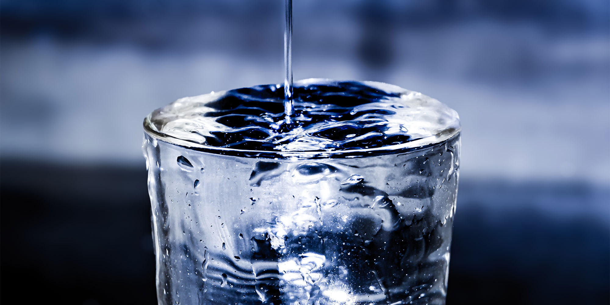 Overflowing glass of water