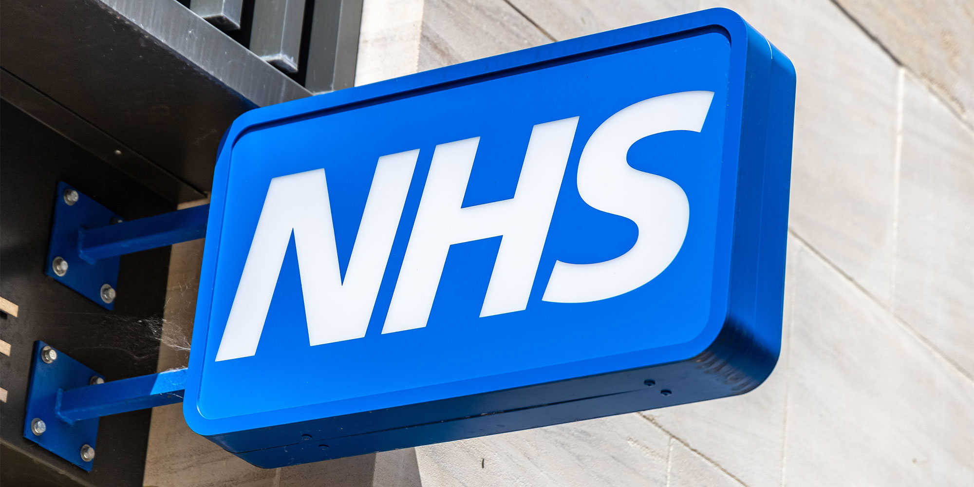 A sign of the NHS logo