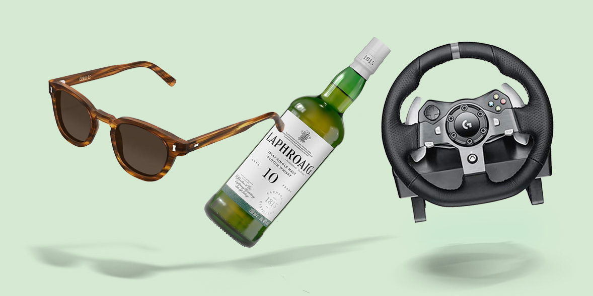 Whisky, sunglasses, and a racing wheel on a green background