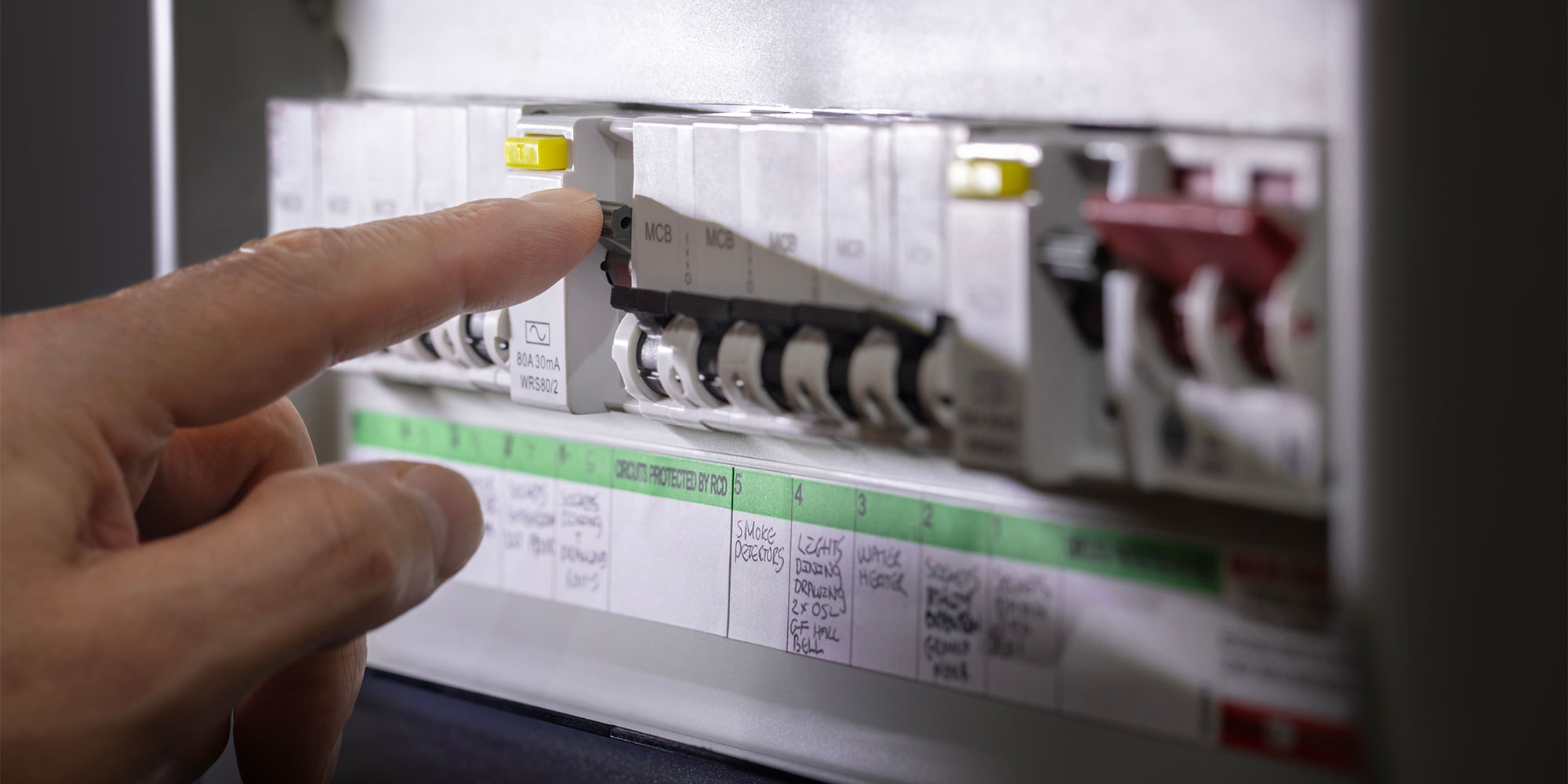 Flicking a switch on an electrical consumer unit