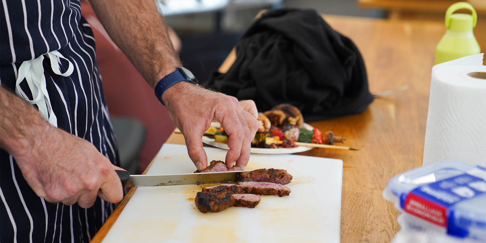 Chef cutting up a steak