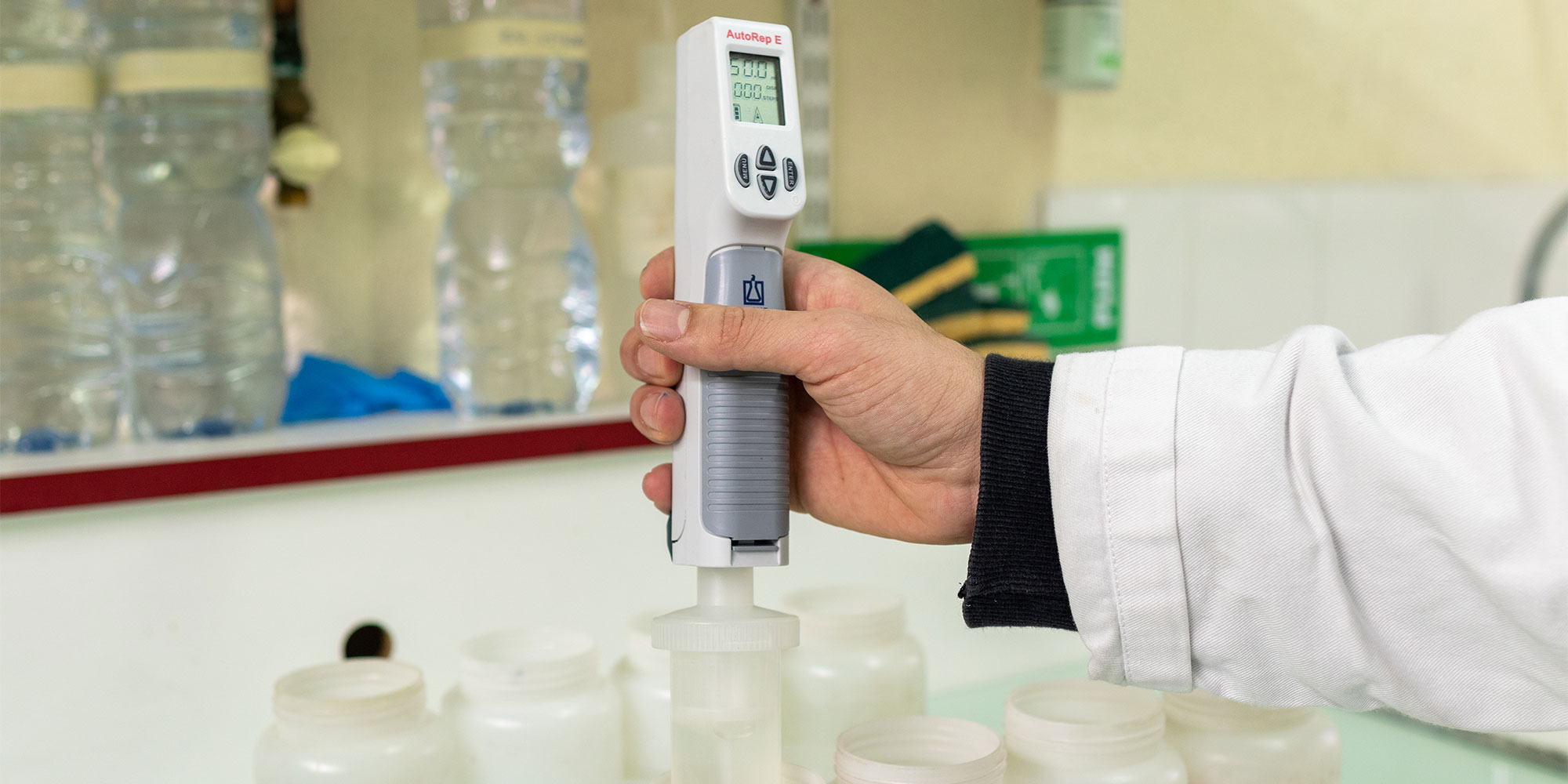 Lab technician analysing sulfonate levels to check how much detergent residue a washing machine's rinse cycle washes away