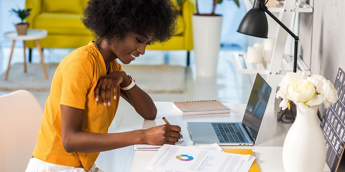 Writing notes in a home office