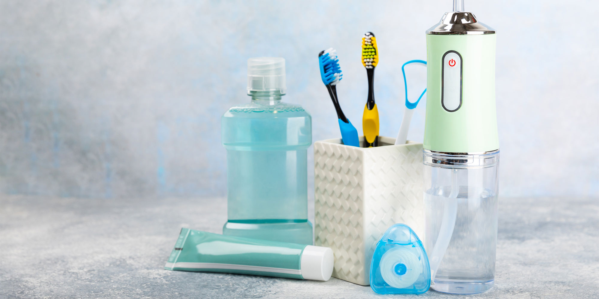 A series of dental products including mouthwash, toothpaste, and toothbrushes
