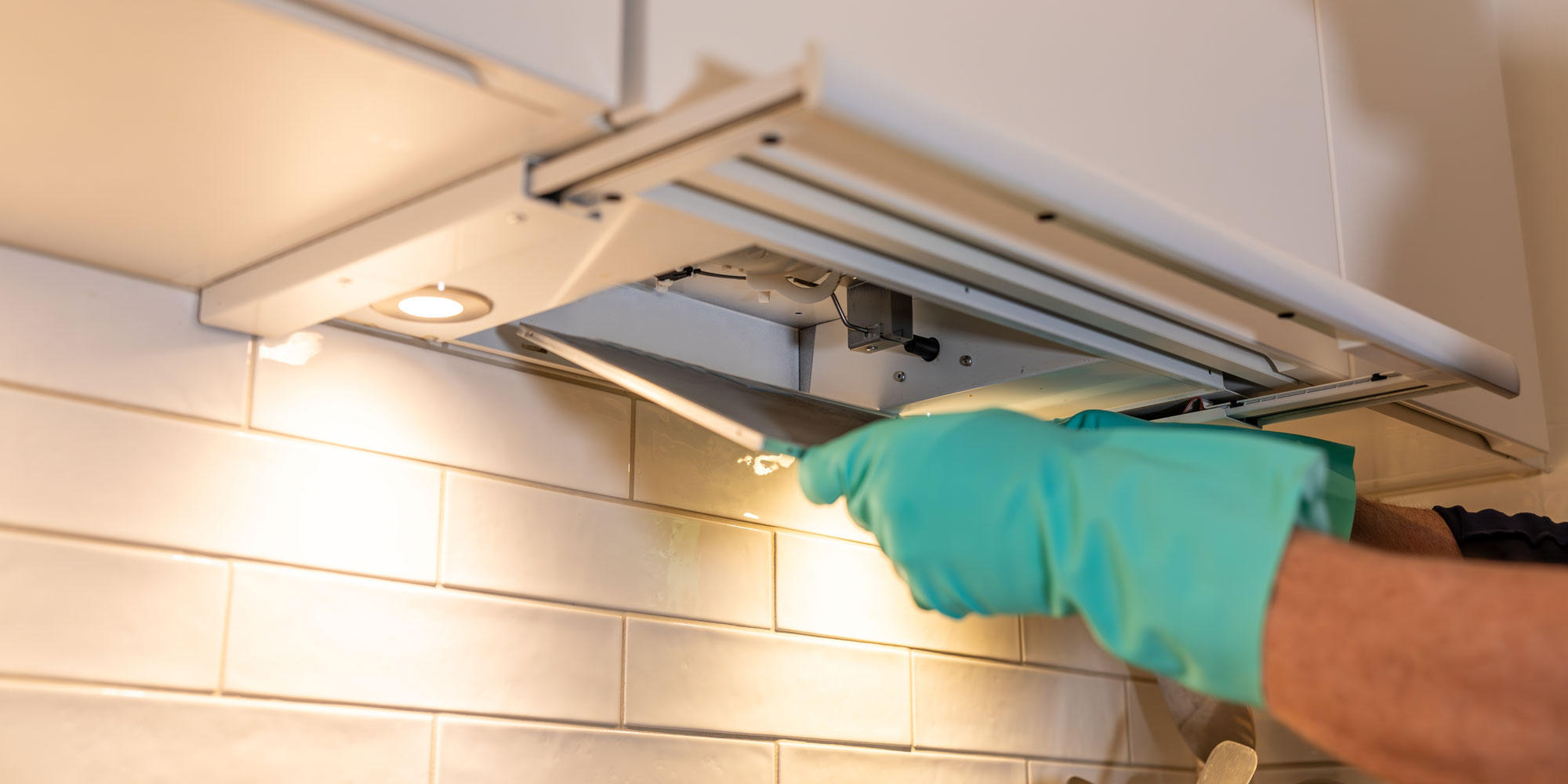 Removing hob extractor filters to clean them