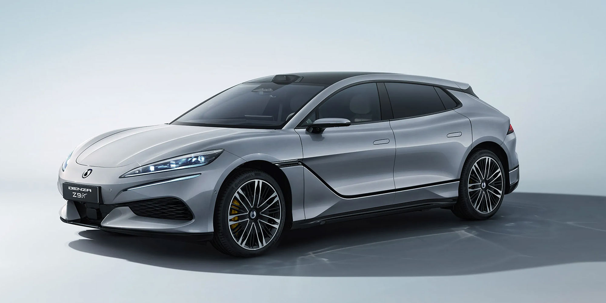 A grey Denza Z9 GT, parked against a grey background