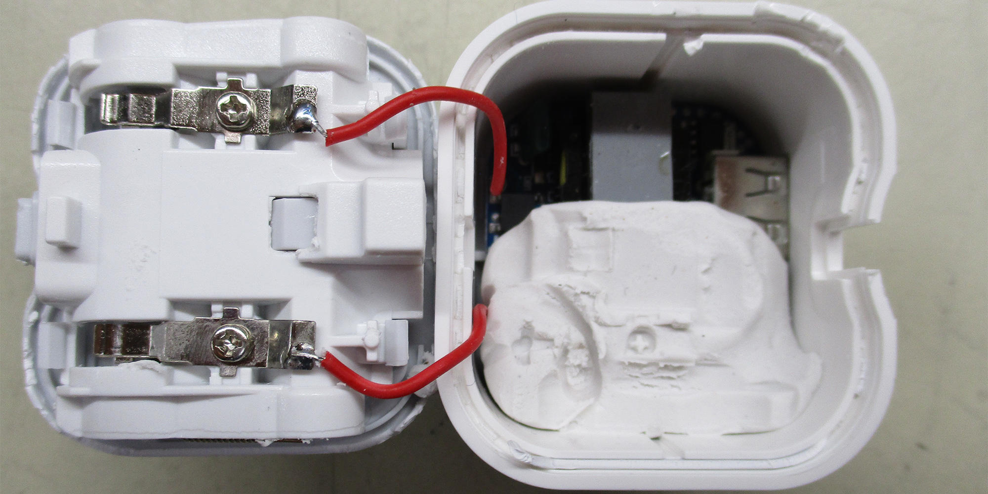 The charger bought from Debenhams was both unsafe and filled with putty to make it feel more substantial. 