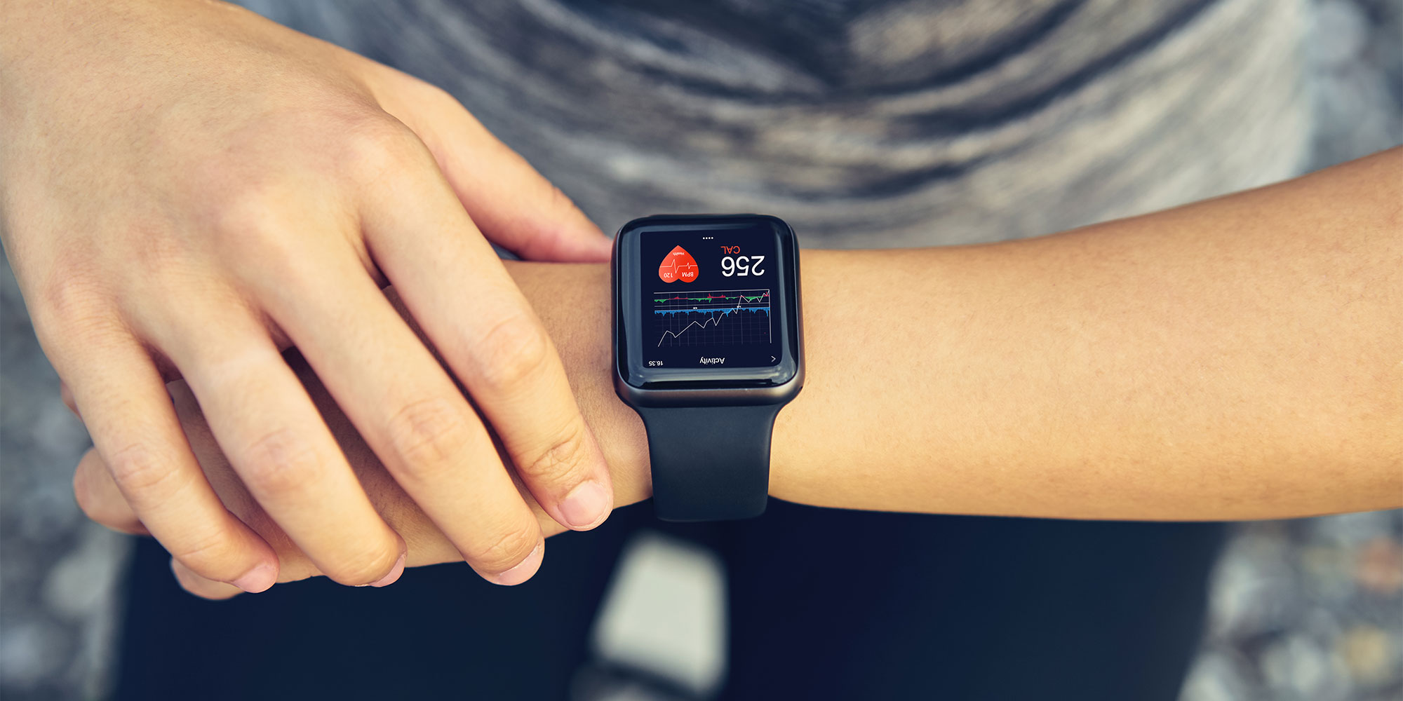 A smartwatch on the wrist of a runner