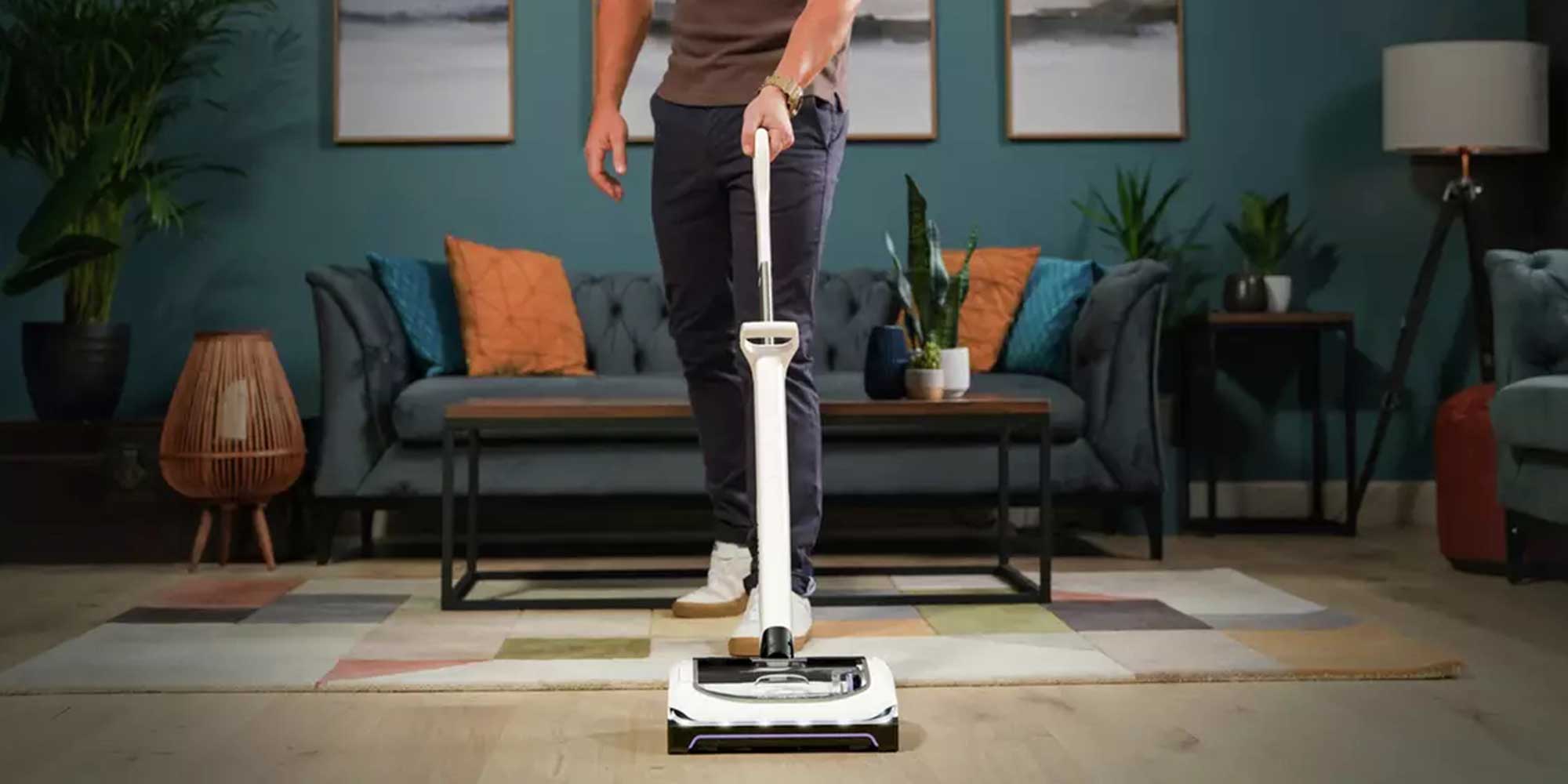 man cleaning with a gtech vacuum