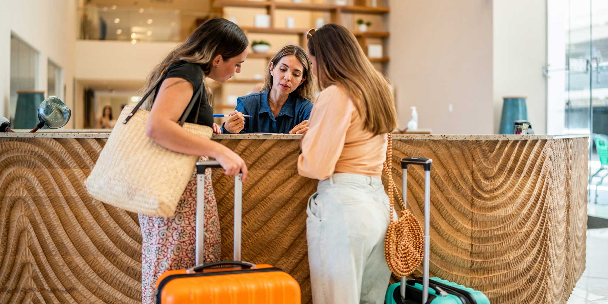 Tourists reviewing the tourist taxes they have been charged at hotel check-in